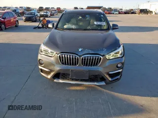 2019 BMW X1 xDrive28i with VIN WBXHT3C51K3H34687, listed as a Copart auction lot 50135845 with 59,549 mi miles and Salvage Title. Bid and sale history available at carsss.com. Image 5.