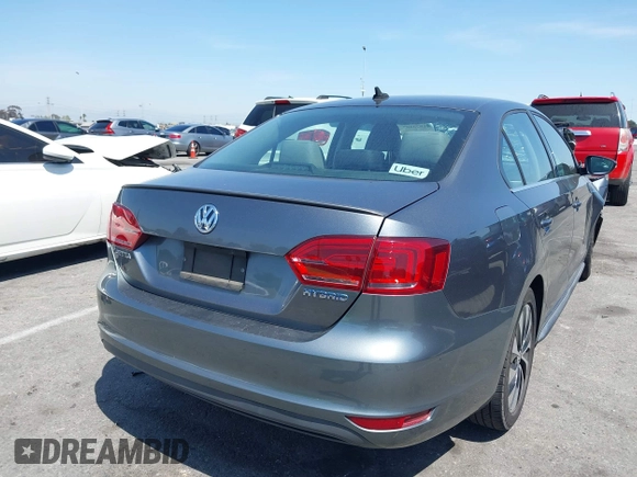 2013 Volkswagen Jetta Hybrid SE with VIN 3VW637AJ1DM232687, listed as a IAAI auction lot 41973407 with 70,428 mi miles and . Bid and sale history available at DreamBid. Image 4.