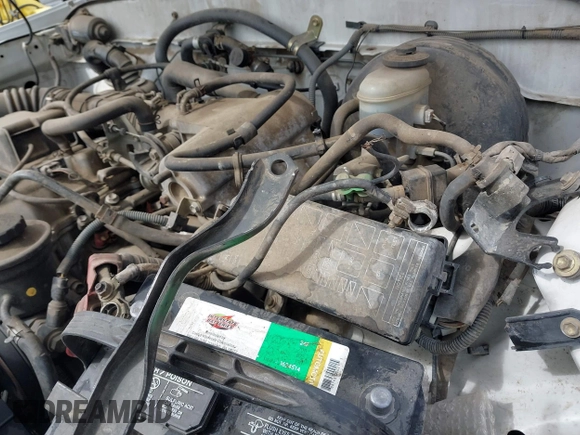 2002 Toyota Tacoma z VIN 5TENL42N02Z099046, wystawiony jako IAAI lot #41774946 z przebiegiem 189 134 mil mil oraz . Historia ofert i sprzedaży dostępna na DreamBid. Obrazek 12.