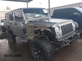 2018 Jeep Wrangler Unlimited Rubicon Recon z VIN 1C4BJWFG1JL851768, wystawiony jako IAAI lot #41882130 z przebiegiem 42 714 mil mil oraz . Historia ofert i sprzedaży dostępna na DreamBid. Obrazek 1.
