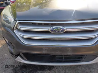2017 Ford Escape SE z VIN 1FMCU0GDXHUB66813, wystawiony jako IAAI lot #42056150 z przebiegiem 86 915 mil mil oraz . Historia ofert i sprzedaży dostępna na DreamBid. Obrazek 6.