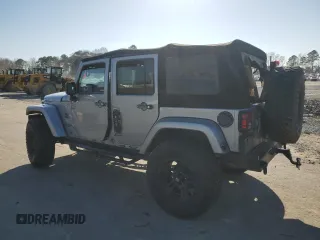 2015 Jeep Wrangler Unlimited Wrangler X with VIN 1C4BJWEG7FL580885, listed as a Copart auction lot 48891605 with 104,448 mi miles and Salvage title. Bid and sale history available at DreamBid. Image 2.