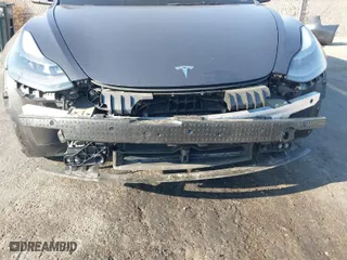 2023 Tesla Model 3 Long Range with VIN 5YJ3E1EB0PF635438, listed as a IAAI auction lot 41630945 with 48,801 mi miles. Bid and sale history available at carsss.com. Image 6.