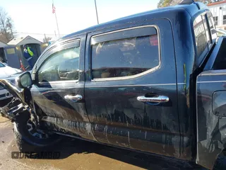2018 Toyota Tacoma SR with VIN 5TFCZ5ANXJX124991, listed as a IAAI auction lot 41136867 with 57,980 mi miles and . Bid and sale history available at carsss.com. Image 14.