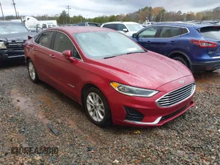 2019 Ford Fusion Hybrid SEL with VIN 3FA6P0MU6KR136726, listed as a IAAI auction lot 41071389 with 103,759 mi miles. Bid and sale history available at carsss.com. Image 1.