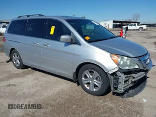 2010 Honda Odyssey Touring with VIN 5FNRL3H97AB015472, listed as a IAAI auction lot 41763680 with 144,309 mi miles. Bid and sale history available at carsss.com. Image 1.