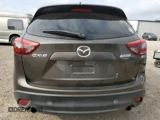 2016 Mazda CX-5 Grand Touring z VIN JM3KE2DY7G0735355, wystawiony jako Copart lot #49438285 z przebiegiem 132 731 mil mil oraz Szkoda całkowita • Salvage title. Historia ofert i sprzedaży dostępna na DreamBid. Obrazek 6.