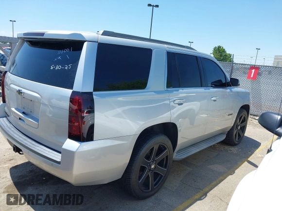 2015 Chevrolet Tahoe LT with VIN 1GNSCBKC9FR111001, listed as a IAAI auction lot 42440624 with 128,087 mi miles and . Bid and sale history available at DreamBid. Image 4.