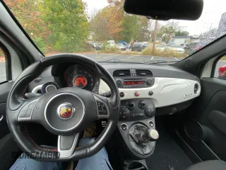 2013 FIAT 500 Abarth z VIN 3C3CFFFH1DT573319, wystawiony jako Copart lot #56000825 z przebiegiem 153 722 mil mil oraz Tytuł czysty. Historia ofert i sprzedaży dostępna na DreamBid. Obrazek 9.
