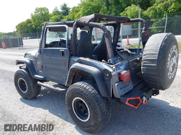 2001 Jeep Wrangler Sport z VIN 1J4FA49S11P322636, wystawiony jako IAAI lot #42409917 z przebiegiem 88 675 mil mil oraz . Historia ofert i sprzedaży dostępna na DreamBid. Obrazek 3.