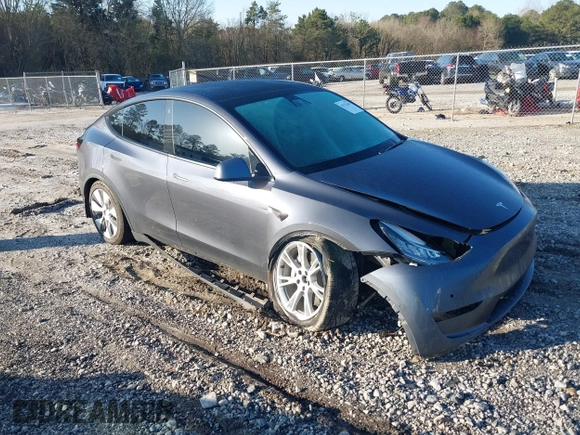 2022 Tesla Model Y Long Range with VIN 7SAYGAEE6NF361883, listed as a IAAI auction lot 41752441 with 50,493 mi miles and . Bid and sale history available at DreamBid. Image 1.