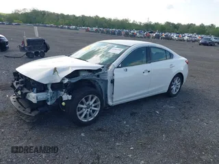 2014 Mazda 6 i Sport with VIN JM1GJ1U62E1116690, listed as a IAAI auction lot 42082188 with 144,137 mi miles and . Bid and sale history available at DreamBid. Image 2.