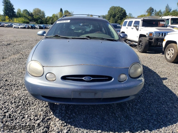 1999 Ford Taurus SE Standard with VIN 1FAFP58U9XG271897, listed as a Copart auction lot 73048784 with 190,518 mi miles and Salvage Title. Bid and sale history available at carsss.com. Image 5.