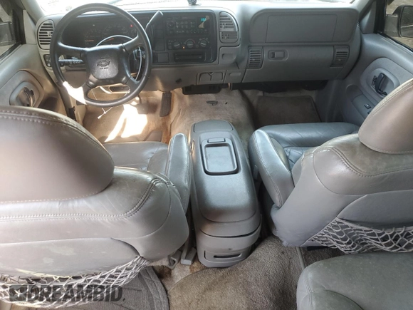 1999 Chevrolet Suburban with VIN 1GNEC16R9XJ490863, listed as a Copart auction lot 65938594 with 176,391 mi miles and Salvage Title. Bid and sale history available at carsss.com. Image 8.