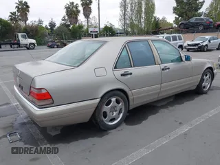 1997 Mercedes-Benz S-Class with VIN WDBGA32G1VA349367, listed as a IAAI auction lot 42079132 with 383,250 mi miles. Bid and sale history available at carsss.com. Image 4.