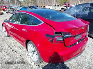 2020 Tesla Model 3 Standard Range Plus with VIN 5YJ3E1EA9LF708808, listed as a IAAI auction lot 40018323 with 32,069 mi miles. Bid and sale history available at carsss.com. Image 3.