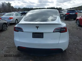 2023 Tesla Model Y Long Range with VIN 7SAYGDEE7PF832007, listed as a IAAI auction lot 41751598 with 14,126 mi miles and . Bid and sale history available at DreamBid. Image 16.