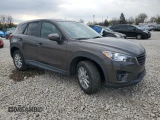 2016 Mazda CX-5 Touring with VIN JM3KE2CY8G0902131, listed as a Copart auction lot 53354745 with 123,474 mi miles and Salvage Title. Bid and sale history available at carsss.com. Image 4.