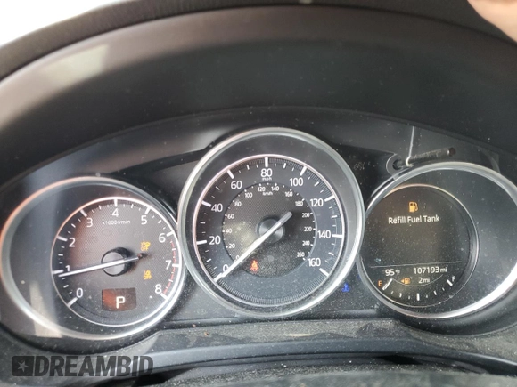 2018 Mazda CX-5 Grand Touring with VIN JM3KFBDM6J0345848, listed as a Copart auction lot 61587865 with 107,193 mi miles and Salvage title. Bid and sale history available at DreamBid. Image 9.