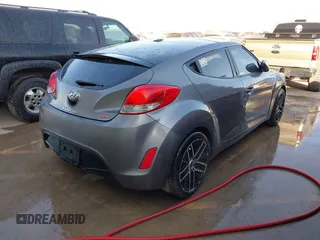 2013 Hyundai Veloster w/Black Int with VIN KMHTC6AD2DU158889, listed as a IAAI auction lot 41878065 with 157,450 mi miles and . Bid and sale history available at DreamBid. Image 4.