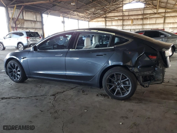 2020 Tesla Model 3 Standard Range Plus with VIN 5YJ3E1EA7LF614913, listed as a Copart auction lot 48518555 with 121,482 mi miles and Salvage Title. Bid and sale history available at carsss.com. Image 2.