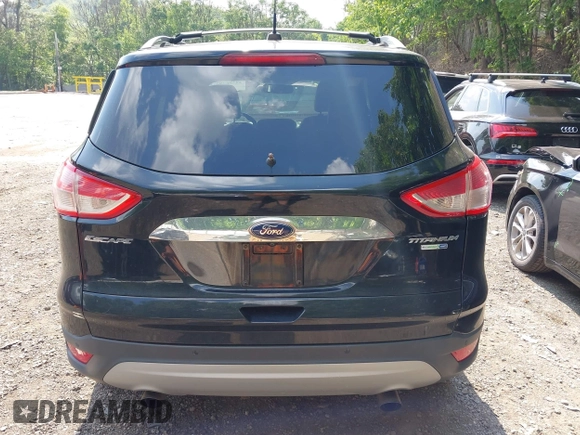 2016 Ford Escape Titanium with VIN 1FMCU9JX1GUC18335, listed as a IAAI auction lot 42396492 with 147,522 mi miles and . Bid and sale history available at DreamBid. Image 16.