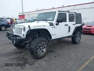 2014 Jeep Wrangler Unlimited Rubicon with VIN 1C4BJWFGXEL283929, listed as a IAAI auction lot 41812052 with 137,790 mi miles and . Bid and sale history available at DreamBid. Image 2.