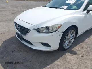 2014 Mazda 6 i Touring with VIN JM1GJ1V64E1142643, listed as a IAAI auction lot 42229322 with 215,095 mi miles and . Bid and sale history available at DreamBid. Image 6.