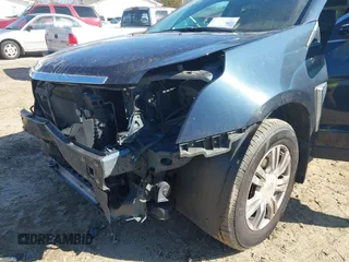 2015 Cadillac SRX with VIN 3GYFNAE35FS608595, listed as a IAAI auction lot 41282751 with 127,055 mi miles and . Bid and sale history available at DreamBid. Image 6.