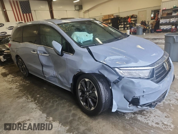 2023 Honda Odyssey Elite with VIN 5FNRL6H90PB071988, listed as a Copart auction lot 58589585 with 12,998 mi miles and Salvage title. Bid and sale history available at DreamBid. Image 4.