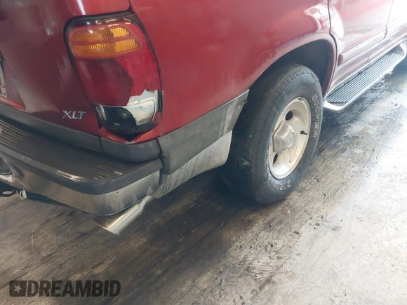 2000 Ford Explorer XLT z VIN 1FMZU83P1YZC54998, wystawiony jako IAAI lot #41613856 z przebiegiem 225 855 mil mil oraz . Historia ofert i sprzedaży dostępna na DreamBid. Obrazek 6.