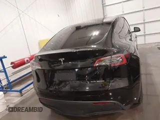 2021 Tesla Model Y Long Range with VIN 5YJYGAEE5MF305655, listed as a IAAI auction lot 41860993 with 50,750 mi miles. Bid and sale history available at carsss.com. Image 16.