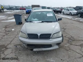 2002 Mitsubishi Lancer ES with VIN JA3AJ26E62U043039, listed as a IAAI auction lot 41600217 with 141,217 mi miles. Bid and sale history available at carsss.com. Image 12.