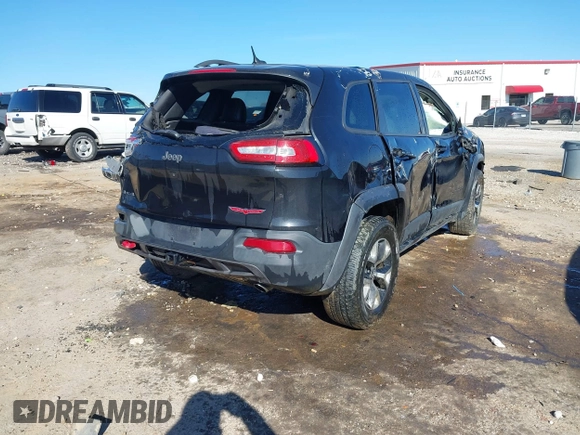 2015 Jeep Cherokee Trailhawk with VIN 1C4PJMBSXFW687737, listed as a IAAI auction lot 40963392 with 119,805 mi miles. Bid and sale history available at carsss.com. Image 4.