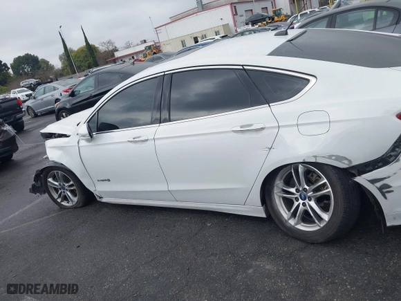 2015 Ford Fusion Titanium Hybrid with VIN 3FA6P0RU3FR247118, listed as a IAAI auction lot 41210219 with 143,348 mi miles. Bid and sale history available at carsss.com. Image 14.