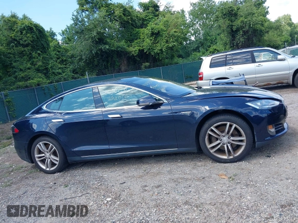 2013 Tesla Model S with VIN 5YJSA1CN0DFP21851, listed as a IAAI auction lot 42557791 with 106,328 mi miles and . Bid and sale history available at DreamBid. Image 14.