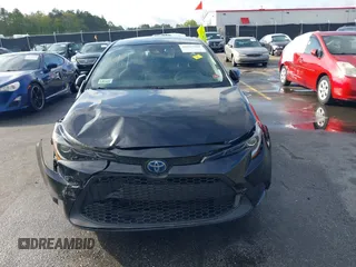 2021 Toyota Corolla Hybrid LE with VIN JTDEAMDE3MJ025426, listed as a IAAI auction lot 41922582 with 57,705 mi miles. Bid and sale history available at carsss.com. Image 13.