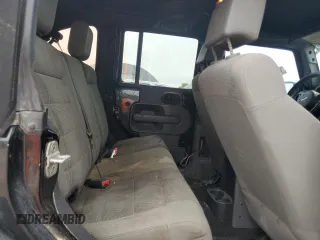 2007 Jeep Wrangler Unlimited Rubicon with VIN 1J4GA69117L112867, listed as a Copart auction lot 59909565 with 166,963 mi miles and Salvage title. Bid and sale history available at DreamBid. Image 11.