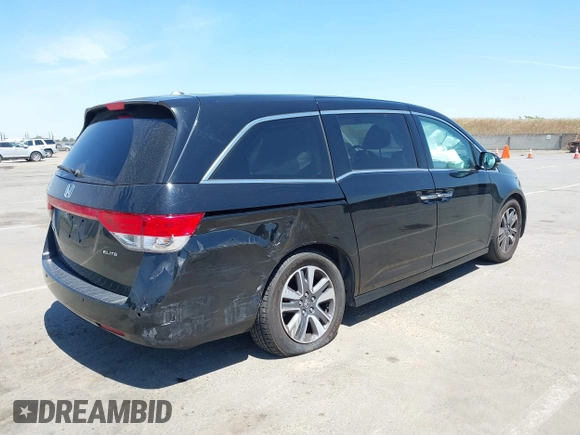 2014 Honda Odyssey Touring with VIN 5FNRL5H99EB133864, listed as a IAAI auction lot 42201359 with 122,490 mi miles and . Bid and sale history available at DreamBid. Image 4.