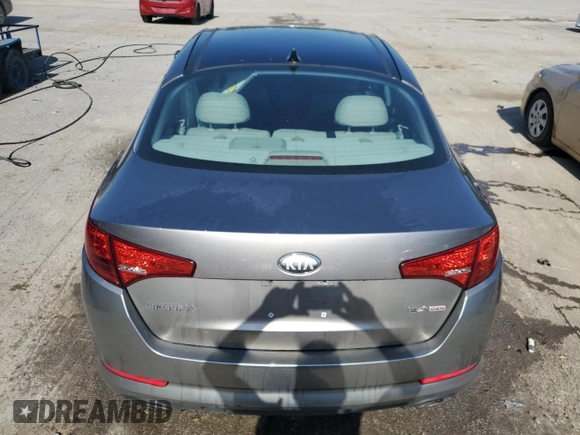 2013 Kia Optima EX z VIN 5XXGN4A73DG228548, wystawiony jako Copart lot #62209395 z przebiegiem 142 692 mil mil oraz Szkoda całkowita • Salvage title. Historia ofert i sprzedaży dostępna na DreamBid. Obrazek 6.