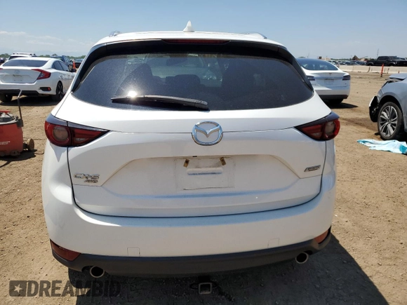 2018 Mazda CX-5 Grand Touring z VIN JM3KFBDM1J0473754, wystawiony jako Copart lot #60362245 z przebiegiem 72 792 mil mil oraz Szkoda całkowita • Salvage title. Historia ofert i sprzedaży dostępna na DreamBid. Obrazek 6.