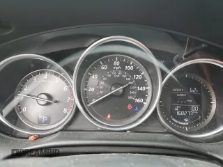 2014 Mazda CX-5 Touring z VIN JM3KE4CY0E0407169, wystawiony jako Copart lot #57877215 z przebiegiem 168 277 mil mil oraz Szkoda całkowita • Salvage title. Historia ofert i sprzedaży dostępna na DreamBid. Obrazek 9.