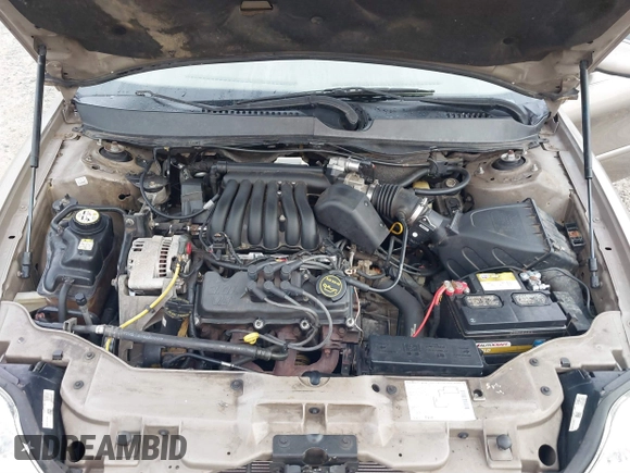 2003 Mercury Sable GS z VIN 1MEFM50U33A606937, wystawiony jako IAAI lot #41058899 z przebiegiem 138 479 mil mil oraz . Historia ofert i sprzedaży dostępna na DreamBid. Obrazek 10.