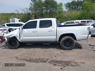 2021 Toyota Tacoma 4WD SR with VIN 3TMCZ5AN2MM414975, listed as a IAAI auction lot 41997227 with 57,729 mi miles. Bid and sale history available at carsss.com. Image 14.