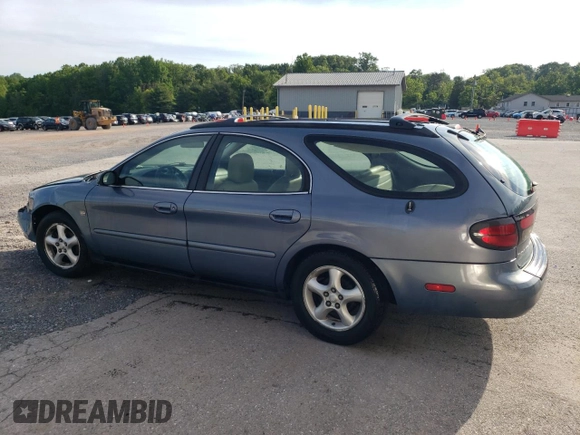 2001 Ford Taurus SE Standard with VIN 1FAHP58S71G184725, listed as a Copart auction lot 56401895 with 163,238 mi miles and Salvage title. Bid and sale history available at DreamBid. Image 2.