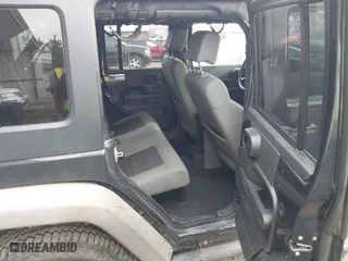 2010 Jeep Wrangler Unlimited Sport with VIN 1J4BA3H13AL125010, listed as a IAAI auction lot 41734482 with 183,773 mi miles. Bid and sale history available at carsss.com. Image 8.