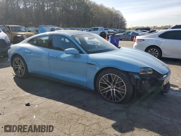 2023 Porsche Taycan with VIN WP0AA2Y11PSA11164, listed as a Copart auction lot 50695385 with 23,833 mi miles and Salvage Title. Bid and sale history available at DreamBid. Image 4.