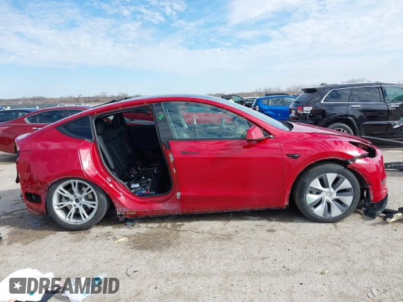 2023 Tesla Model Y Long Range with VIN 7SAYGDEE5PA198483, listed as a IAAI auction lot 41433952 with 24,753 mi miles and . Bid and sale history available at DreamBid. Image 14.
