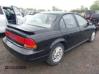 1999 Saturn SL with VIN 1G8ZK5272XZ263163, listed as a IAAI auction lot 42180002 with 138,463 mi miles. Bid and sale history available at carsss.com. Image 4.