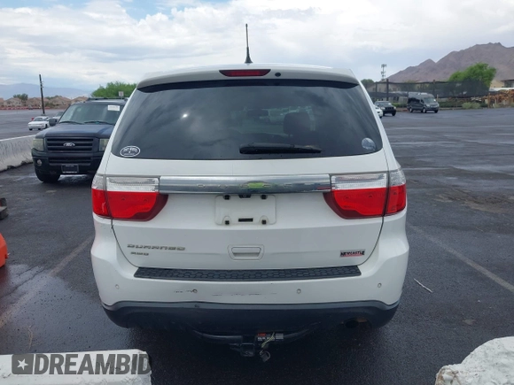 2013 Dodge Durango SXT with VIN 1C4RDJAG7DC659050, listed as a IAAI auction lot 42637236 with 162,458 mi miles and . Bid and sale history available at DreamBid. Image 16.